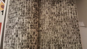 black and white double page spread of hundreds of ID pictures