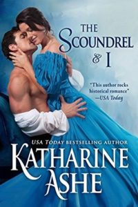 Lady in a blue historical-type dress in an embrace with a shirtless man.