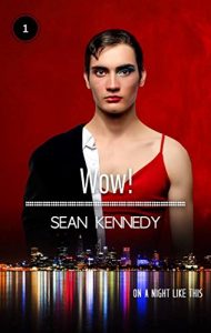 Head and upper body of a short-haired brunet man against a red background, the left side of him is in a suit, the right side is in a red dress with drag queen makeup