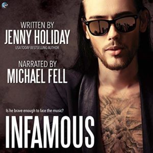 face and upper chest of a hot rock star wearing dark sunglasses and a leather jacket but no shirt, his visible chest tattooed