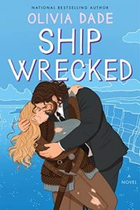 Illustrated cover in blue featuing a white M/F couple in a clinch. He has dark longish hair and a beard and she has long wavy blonde hair. They're both big and broad. He's wearing a dark suit and tie and she's in costume wearing something like a pirate outfit with a sword.