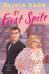 Illustrated cover in dusky pink/rosey colours featuring a "spite house" -very skinny house in between 2 bigger buildings in the background. In front in the foreground are a white couple; she is fat and pretty, wearing a filmy dress with tiny strawberries on and he is wearing a dark suit and tie and quirking an eyebrow. They are facing the front rather than looking at each other.