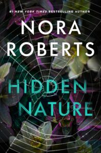 Photo realistic image of dark green foliage and white, purple and yellow flowers, overlaid by a spider web (thankfully unoccupied).