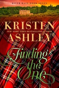 Cover has lots of red-based tartan in the bottom 2/3 of the cover with the title and author name in cursive over the top and at the top of the cover is an image of a castle/manor house at sunset surrounded by woods