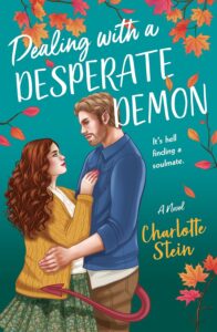 Illustrated cover, teal green background with autumn leaves scattered about and titles in white at the top. On the left is a white couple, a woman on the far left and a man toward the middle. The woman has long curly/wavy reddish brown hair and is wearing a mustard coloured cardigan, a white top and a green skirt with little pale pink and blue flowers on it. The guy is wearing a blue collared sweater and brown pants, he is fair-haired and has stubble and a demon's red tail is coming out of his pants and is wrapping around the front of the cover and across the woman's skirt